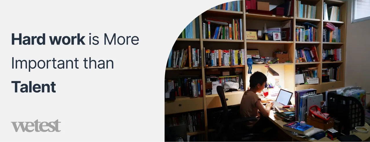 A boy studying late into the night surrounded with books and a laptop