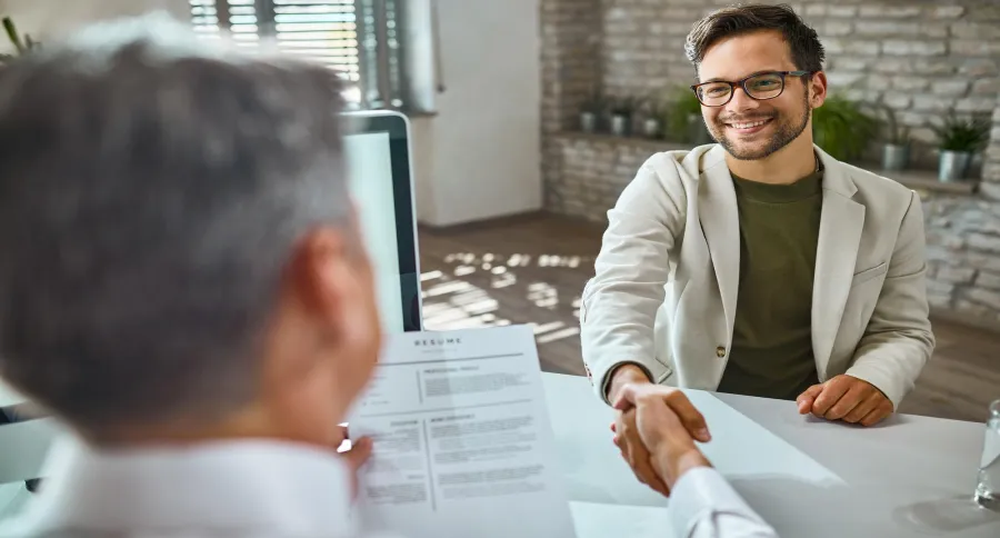 a recruitment agent shaking hands with a candidate