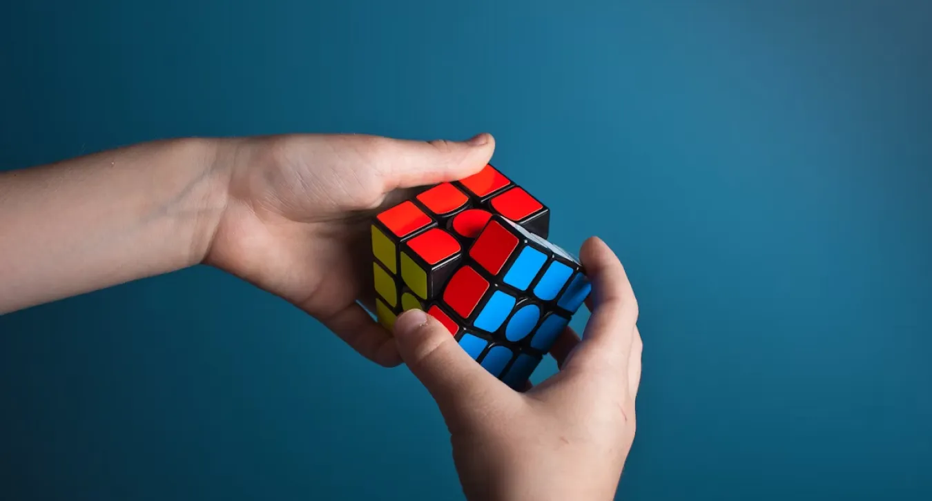 A person solving a rubric's cube