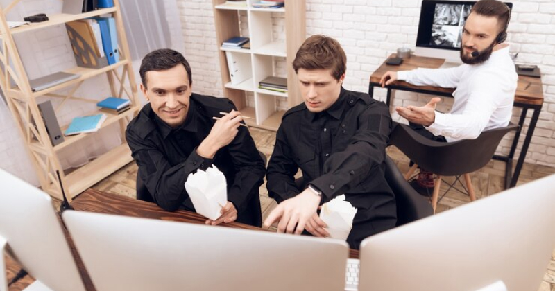 employees playing games and eating at office