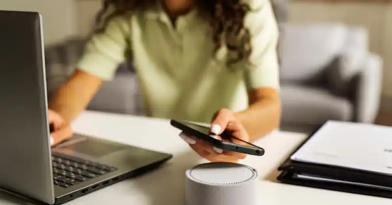 a person using bluetooth speaker