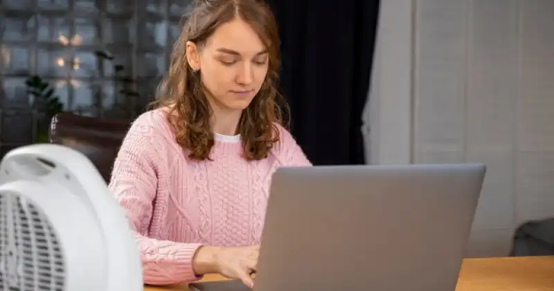 a person working behind laptop