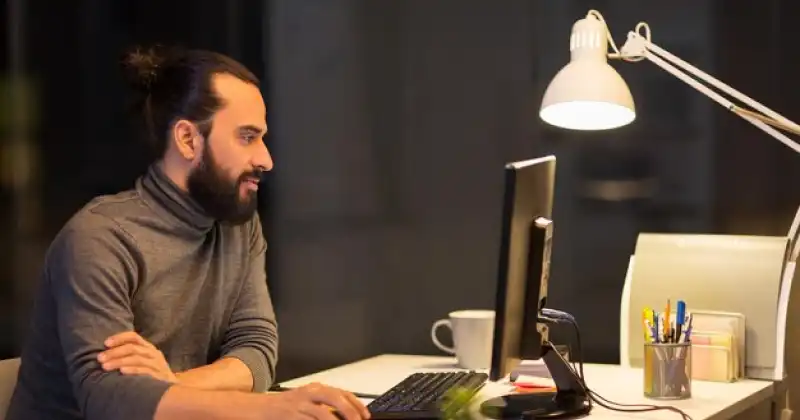 a person working behind laptop