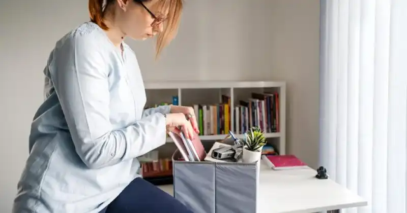 person organizing her desk