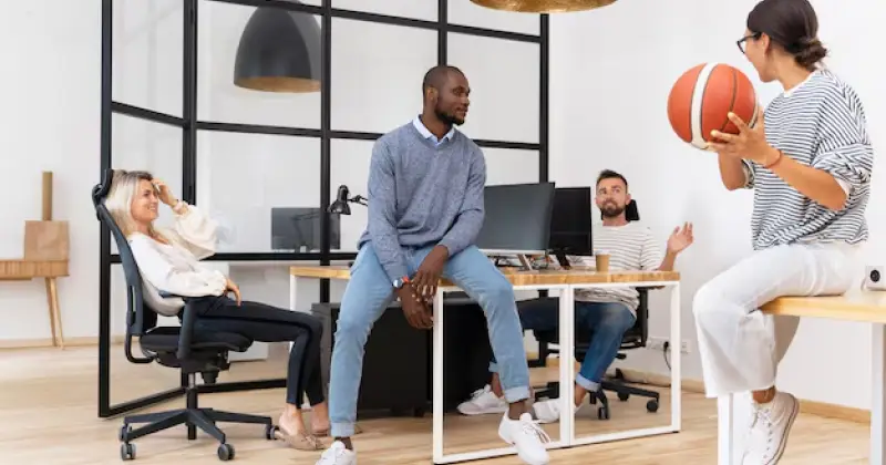 employees play sport in office