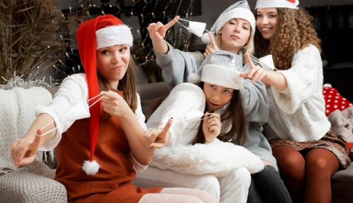 Co-workers having fun in office during Christmas