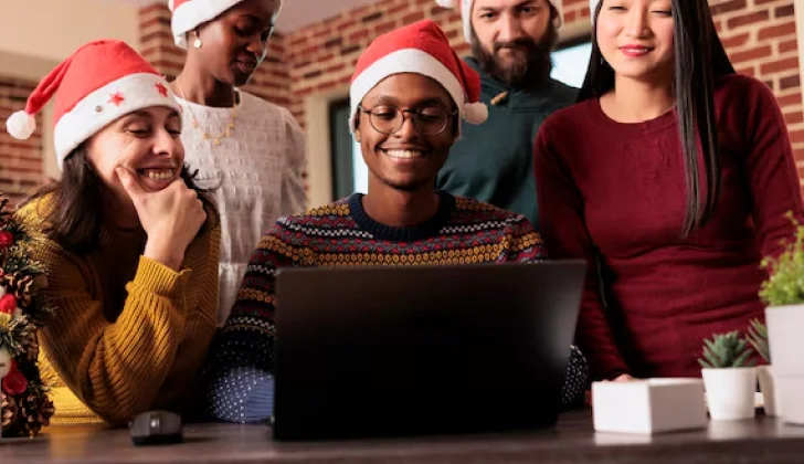 employees watching a movie during Christmas