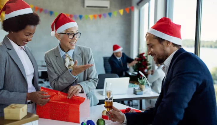 Co-workers playing secret Santa at work
