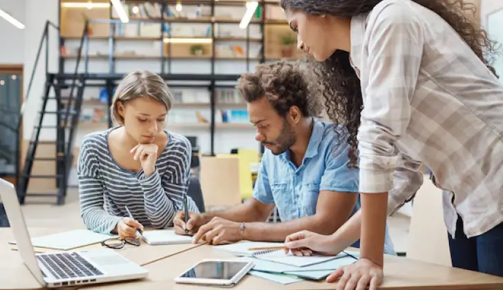 colleagues having meeting at work