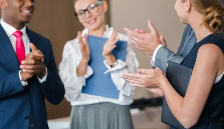 employee cheering a co-worker