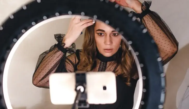 a person using a ring light