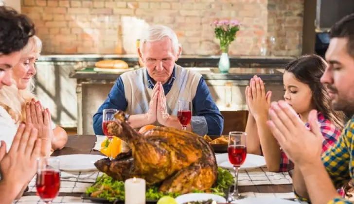 a family eating Turkey