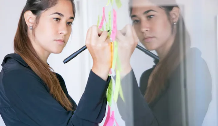 an employee taking notes