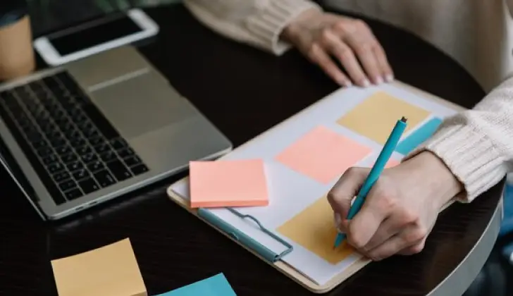 a person using a Sticky Notebook