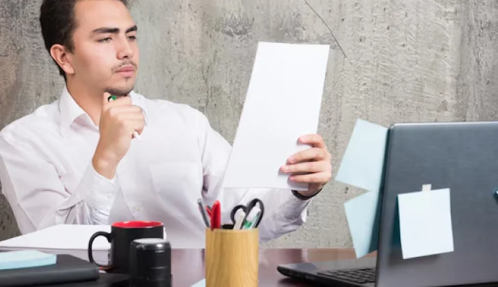 an employee reading a letter