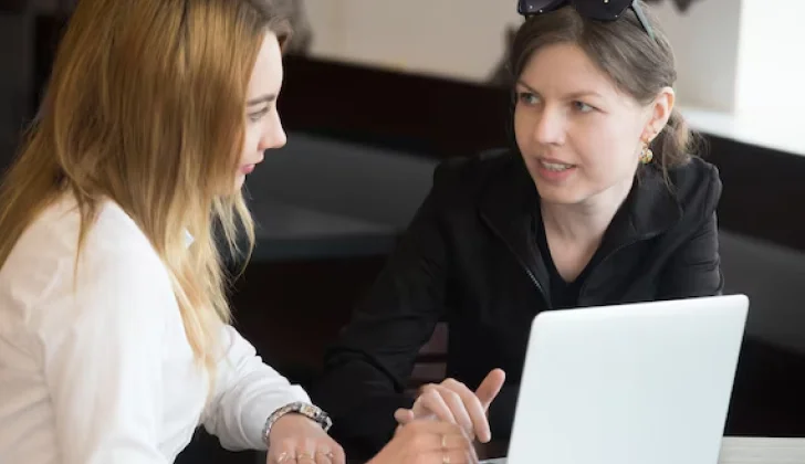 an employer and employee discussing work
