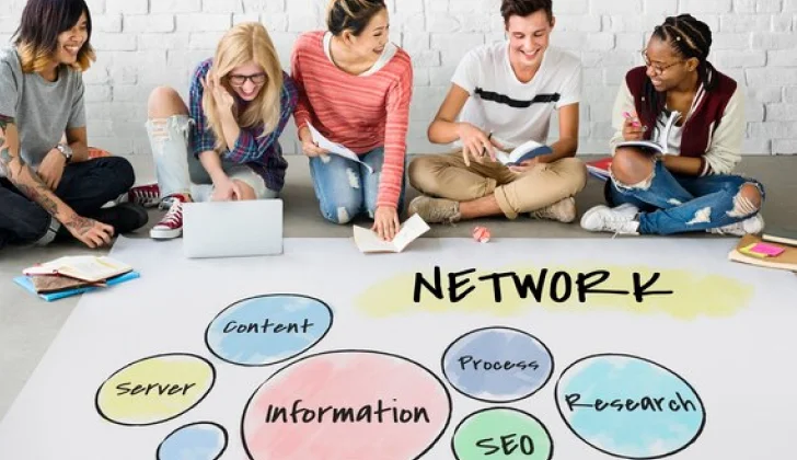 a group pf employees working on company network plans