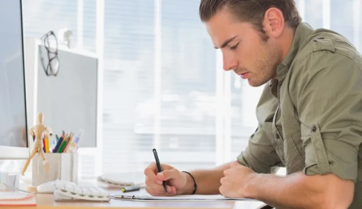 a guy writing a professional letter
