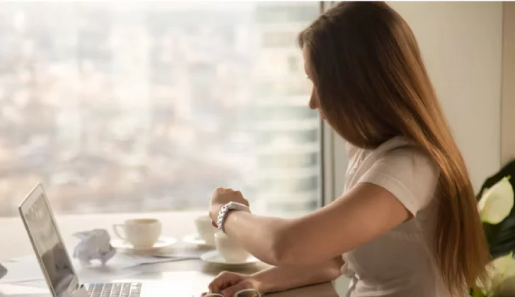 a girl looking at her watch