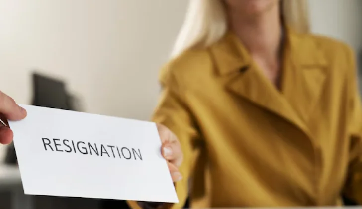 an employee handing over her resignation letter