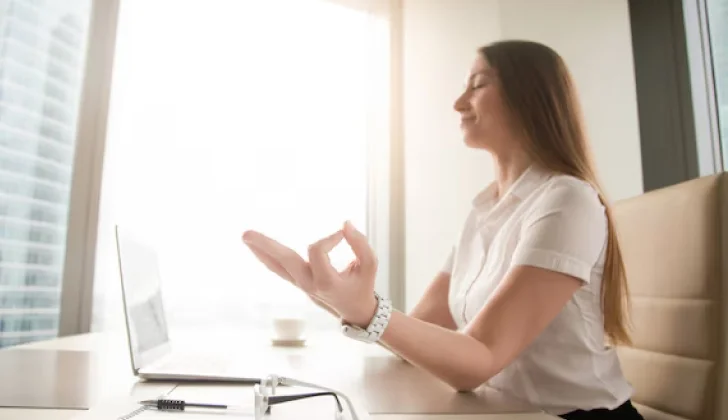 a girl doing meditation at work