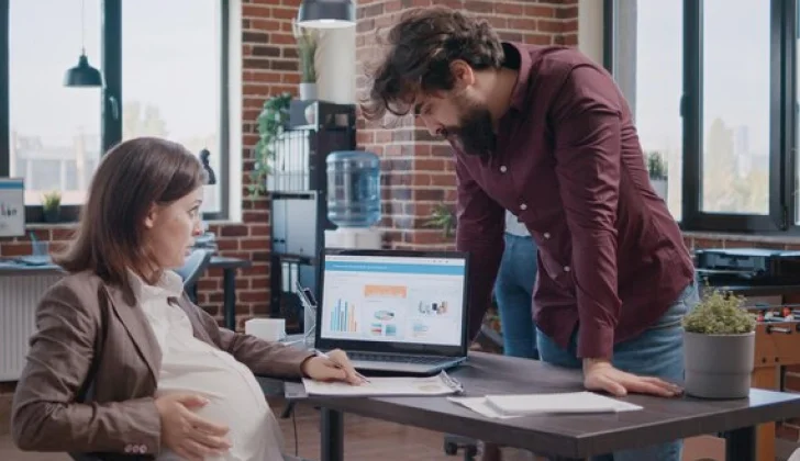 a pregnant employee at work