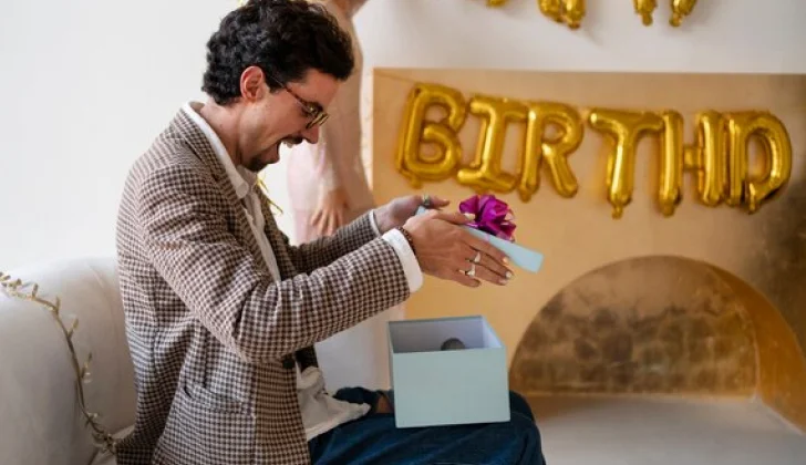 a person opening a gift