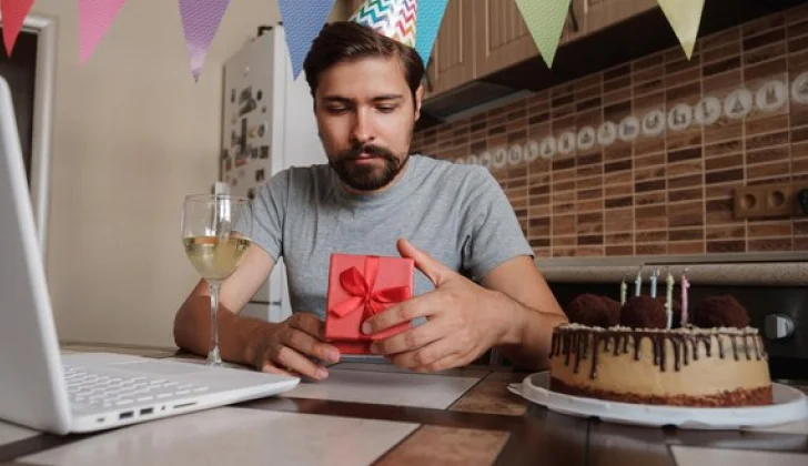 a person opening a gift