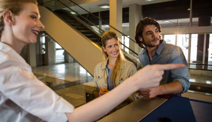 an employee showing a task to other employees