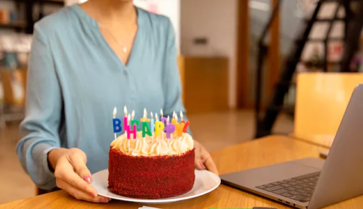 a person with a birthday cake