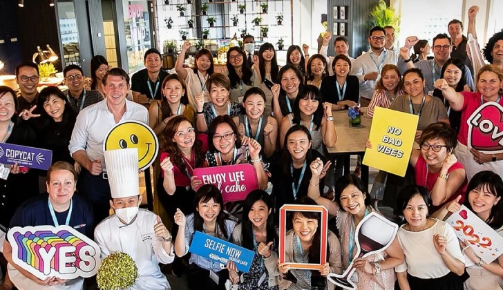 Hilton employees gathering together