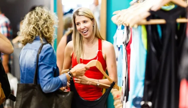 a Lululemon employee talking to customer