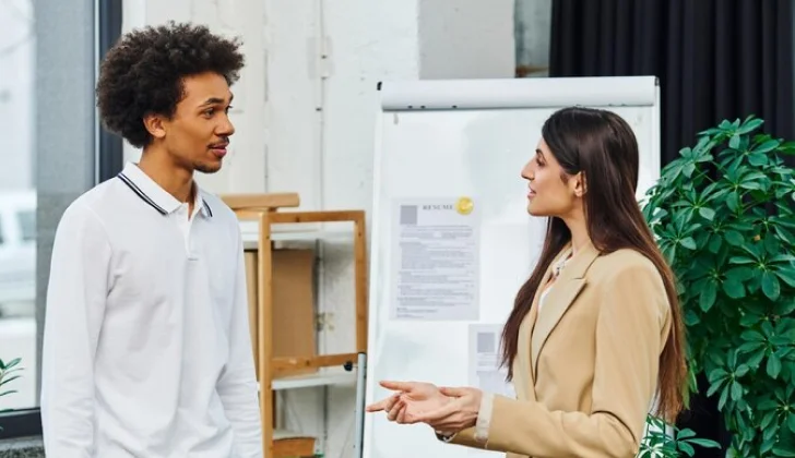 two team members talking
