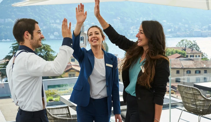 Hilton employees giving high five