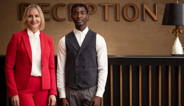 Hilton employees at hotel reception