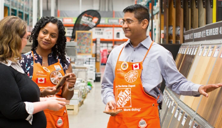 home depot employees talking to a customer