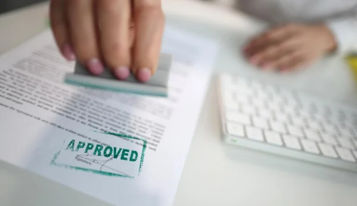 a person approving a form