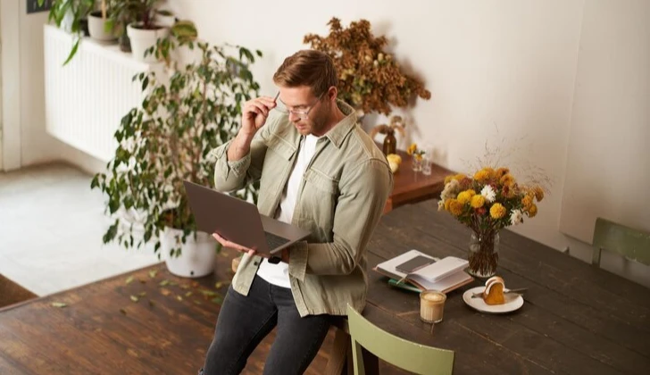 an employee checking his laptop