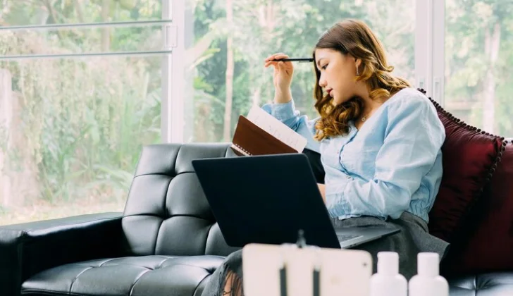 a women checking her notes