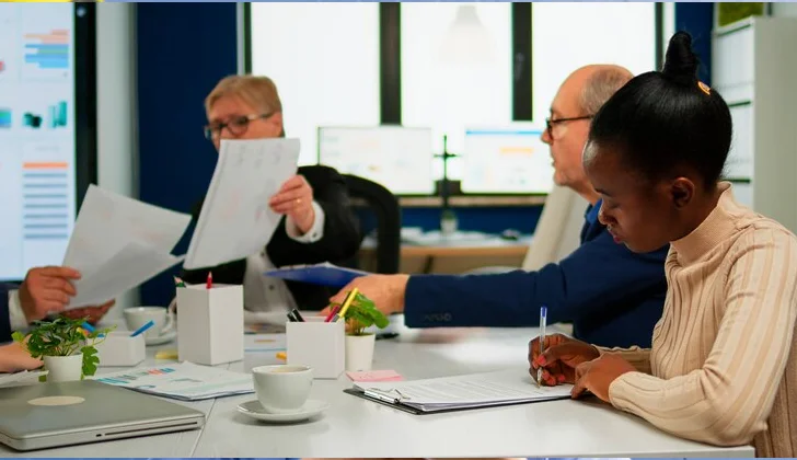 team members writing down reports