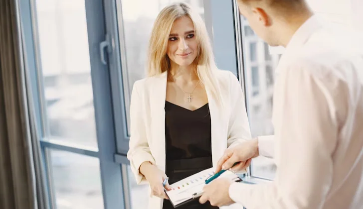 two employees talking