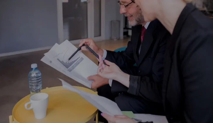 two people reading a chart