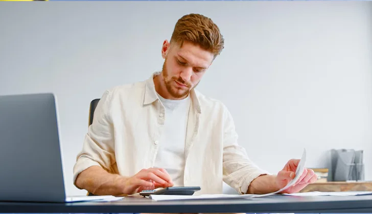 a man calculating some accounts