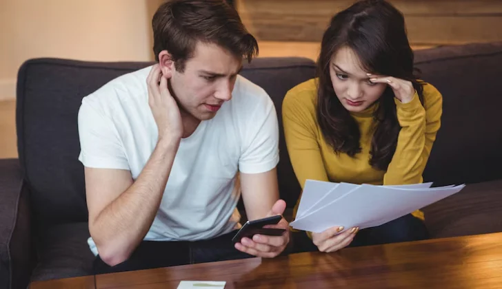a man and woman checking legal documents