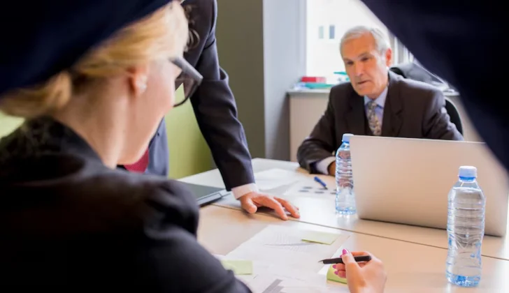a man and women discussing a legal claim