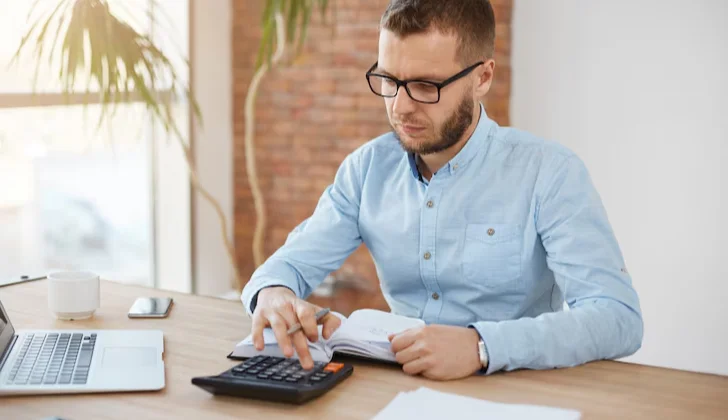 a man using a calculator
