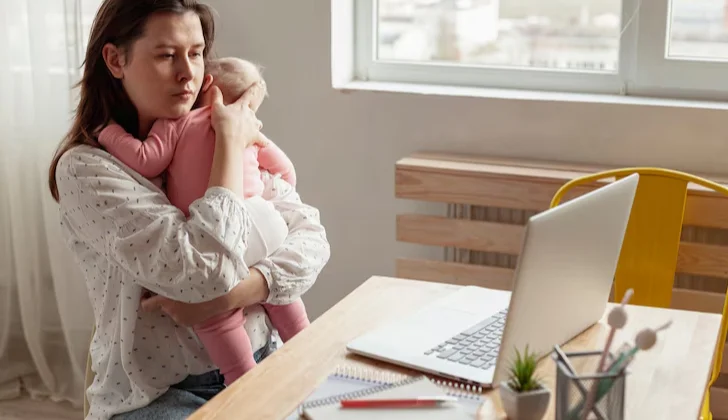 a woman holding her baby