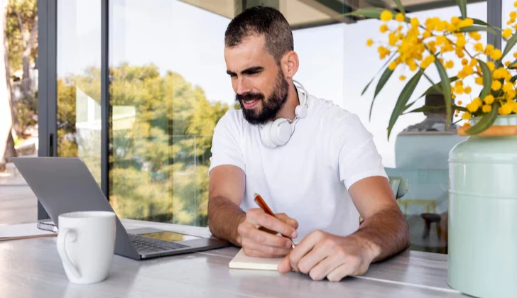 an employee writing down notes