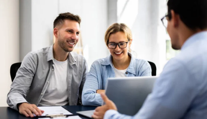 two employees at a meeting with employer