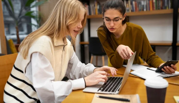 two woman checking a task